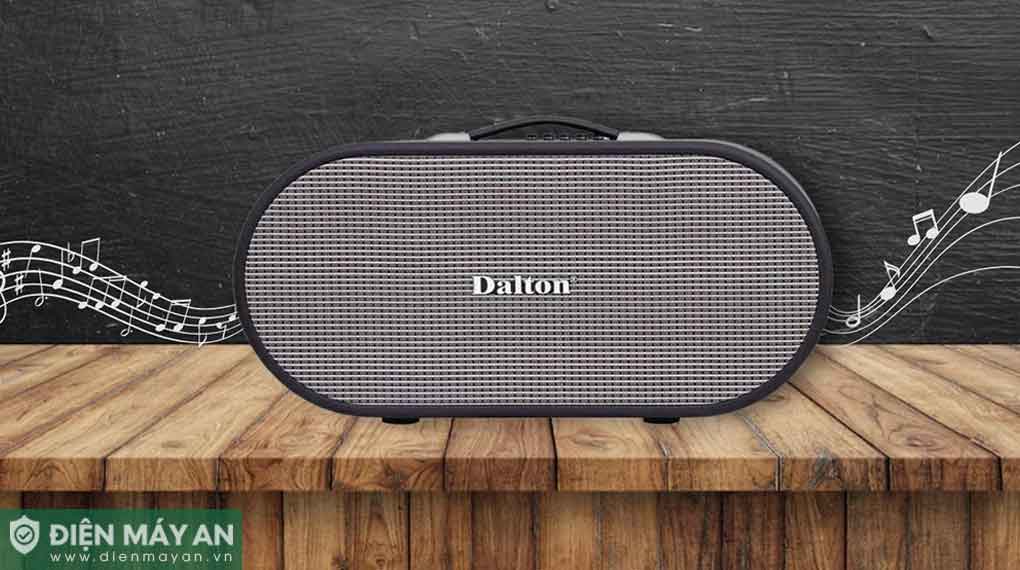 Loa bluetooth Dalton màu đen xám đặt trên mặt gỗ với nền nhạc họa tiết nốt nhạc